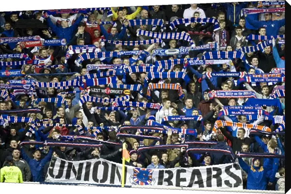 Triumphant Rangers Fans Celebrate in Scarfs: A Glorious 3-0 Victory at Ibrox Stadium