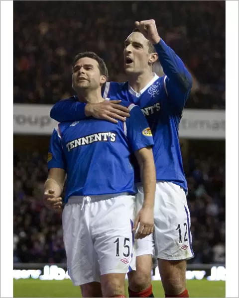 Triumphant Rangers: Healy and Wallace Celebrate Historic 3-0 Victory over Motherwell at Ibrox Stadium