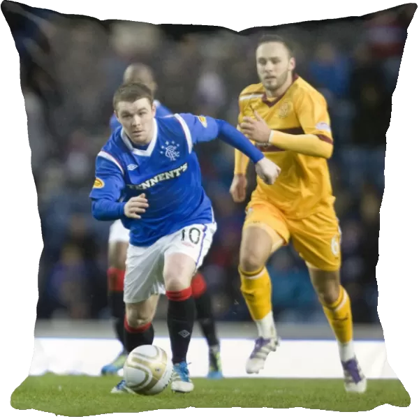 John Fleck vs. Tom Hateley: Intense Clash Between Rangers Midfielder and Motherwell's Defender at Ibrox Stadium during Rangers 3-0 Clydesdale Bank Scottish Premier League Victory