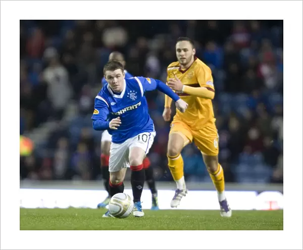 John Fleck vs. Tom Hateley: Intense Clash Between Rangers Midfielder and Motherwell's Defender at Ibrox Stadium during Rangers 3-0 Clydesdale Bank Scottish Premier League Victory