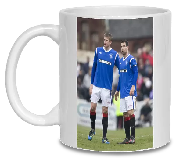 Deep in Thought: Dorin Goian and Carlos Bocanegra's Intense Conversation Amidst Rangers 4-0 Scottish Cup Triumph Over Arbroath