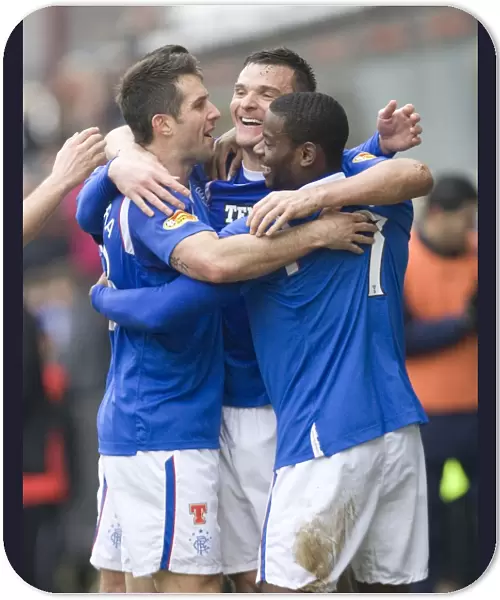 Rangers Triumph: McCulloch, Bocanegra, and Edu Celebrate Goals Against Dunfermline (4-1)