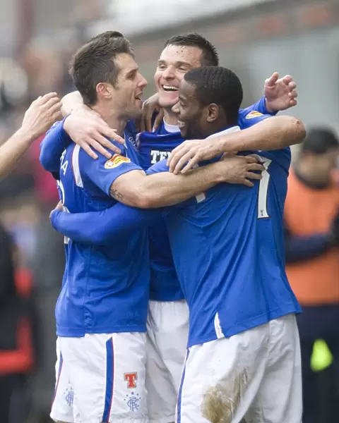 Rangers Triumph: McCulloch, Bocanegra, and Edu Celebrate Goals Against Dunfermline (4-1)