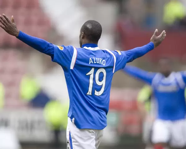 Rangers Sone Aluko Celebrates Glory: A 19-Year-Old's Exultant Moment as Rangers Crush Dunfermline 4-1 in the Scottish Premier League