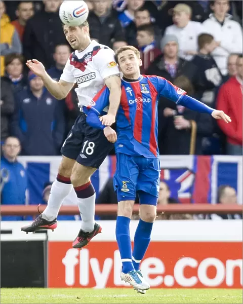 Rangers Carlos Bocanegra Clears Path Amidst Inverness Thistle Pressure in Scottish Premier League