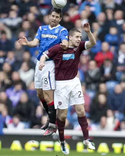 Bocanegra vs Glen: A Tight 1-2 Victory for Hearts in the Clydesdale Bank Scottish Premier League Clash at Ibrox Stadium