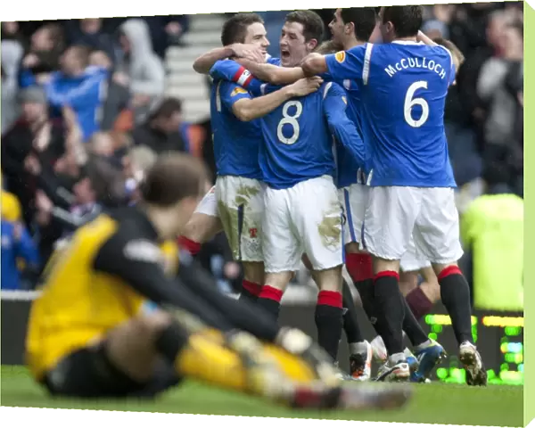 Stevenson's Double Strike: A Bittersweet Moment for Rangers as Hearts Take the Lead (1-2) - Rangers Players Celebrate with Steven Davis