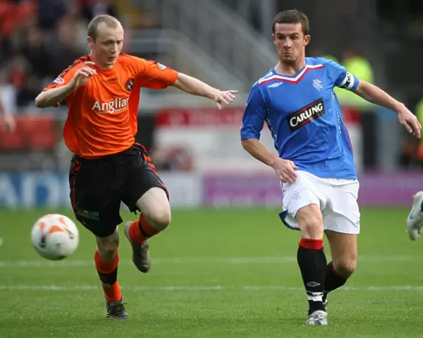 Barry Ferguson vs Willo Flood: A Rivalry Ignites in the Intense Dundee United vs Rangers Clydesdale Bank Premier League Match (2-1 in favor of Rangers)