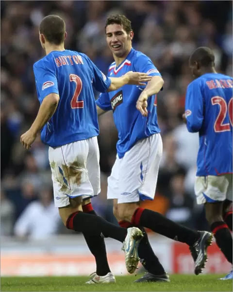 Rangers Carlos Cuellar and Alan Hutton: A Celebratory Moment after Scoring against Inverness Caledonian Thistle (2-0)