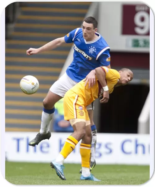 Rangers Lee Wallace Evades Motherwell's Chris Humphrey in Thrilling Clydesdale Bank Scottish Premier League Clash (1-2)
