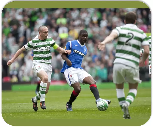 Celtic Park Rivalry: Maurice Edu vs. Scott Brown in Celtic's 3-0 Clydesdale Bank Scottish Premier League Victory