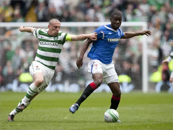 Celtic Park Rivalry Reaches a Boiling Point: Celtic's Scott Brown vs. Rangers Maurice Edu in Celtic's 3-0 Scottish Premier League Triumph