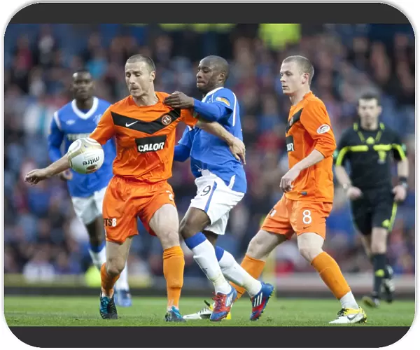 Rangers Sone Aluko vs. Paul Dixon: A Battle in Rangers 5-0 Victory over Dundee United at Ibrox Stadium (Scottish Premier League)