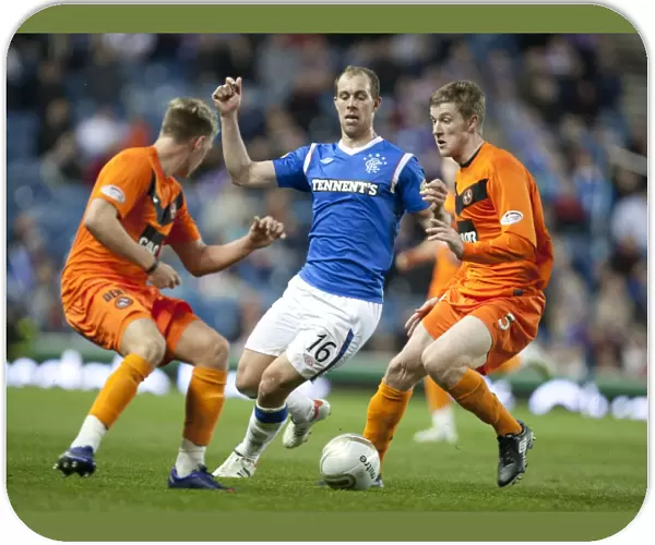 Rangers Unstoppable Triumph: Whittaker Stands Firm Against Douglas and Dixon's Challenge in 5-0 Clydesdale Bank Scottish Premier League Showdown at Ibrox Stadium