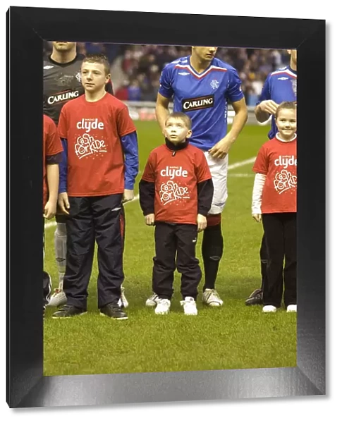 Rangers Football Club's Thrilling 2-1 Victory with Cash the Mascot at Ibrox for Cash for Kids Charity Event