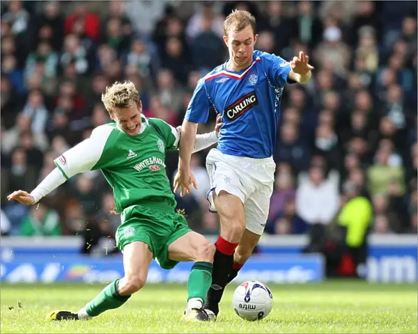 Intense Rivalry: Rangers vs Hibernian's Battle for the Ball in the Scottish Cup Fifth Round Replay at Ibrox (1-0)