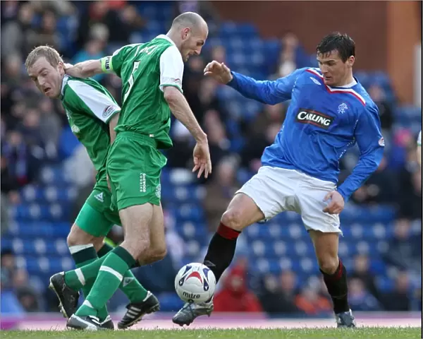 Determined Clash: Lee McCulloch vs Jones and Kerr in the Scottish Cup Fifth Round Replay: Rangers 1-0 Hibernian