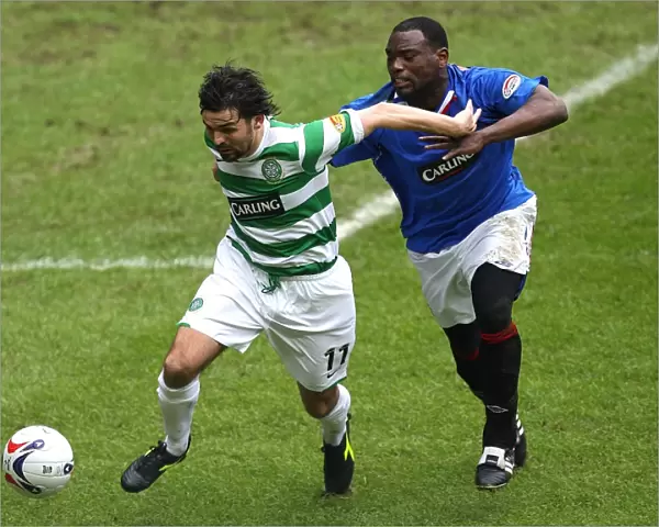 Intense Rivalry: Darcheville vs Hartley - A Pivotal Moment in the Rangers vs Celtic Scottish Premier League Clash (1-0 to Rangers)