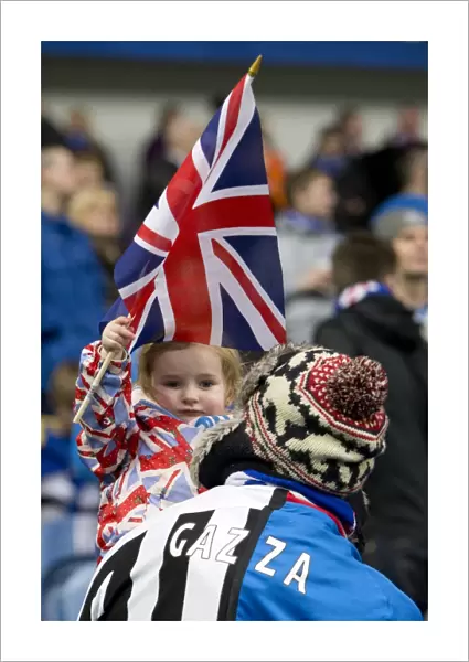 Rangers Fans Unwavering Pride: A 4-0 Victory over Queens Park at Ibrox Stadium with Daughter in Rangers-Newcastle Strip and a Dedicated Fan in Split Loyalties Waving the Union Jack