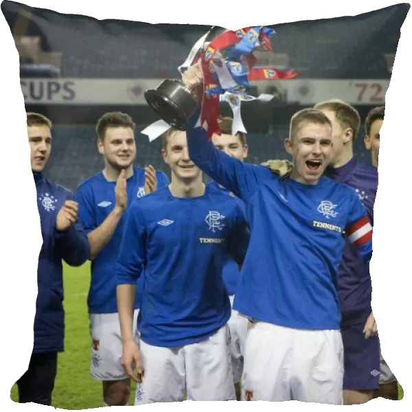 Rangers Reserves: Andy Mitchell Lifts the SFL Reserve League Trophy after Securing Victory over Queens Park Reserves (2-0)