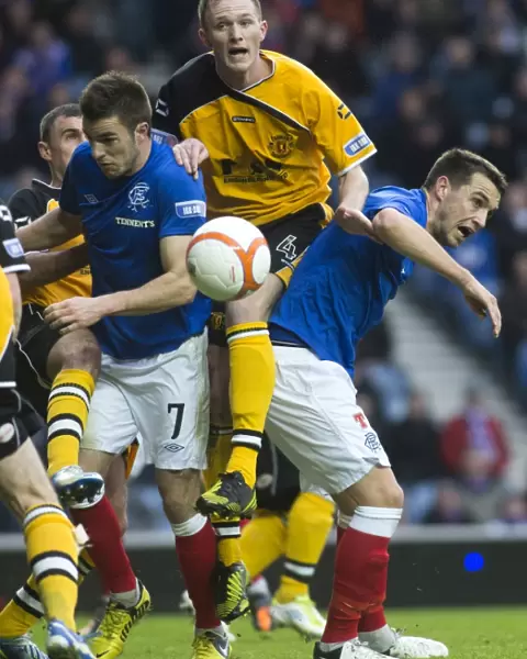 A Tight Battle at Ibrox Stadium: Rangers Andy Little and Chris Hegarty vs Annan Athletic's Martin McNiff
