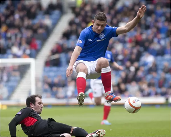 Fraser Aird's Soaring Leap: Rangers Take 2-0 Lead Over Clyde at Ibrox Stadium