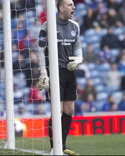 Upset at Ibrox: Peterhead's 1-2 Victory Over Rangers (Graeme Smith Stands Victorious)