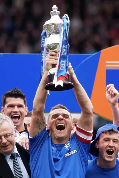 Rangers Football Club: Lee McCulloch's Triumphant Promotion Celebration with the Irn Bru Trophy at Ibrox Stadium