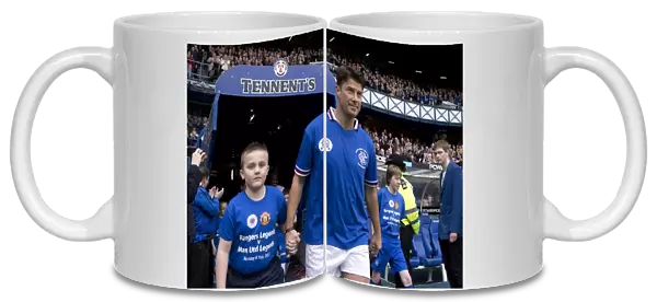 A Classic Soccer Showdown at Ibrox Stadium: Rangers Legends vs Manchester United Legends - Brian Laudrup and the Rangers Mascot: Unforgettable Clash of Soccer Greats