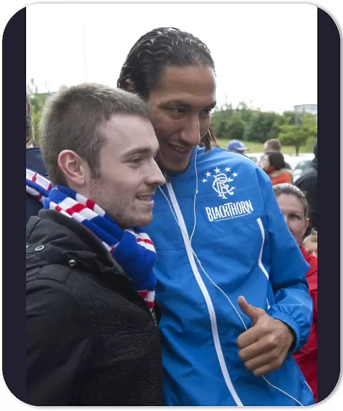 Rangers Bilel Moshni Celebrates Glory with Ecstatic Fan after Albion Rovers Defeat: 0-4 Rangers