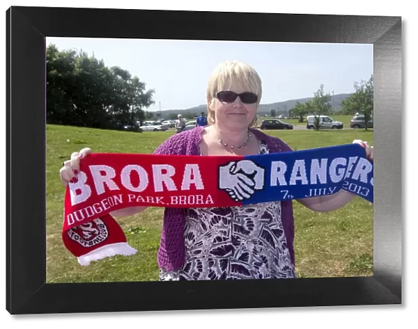 Brora Rangers vs Rangers: Scarf Vendor Amidst the Excitement of a 2-0 Rangers Victory