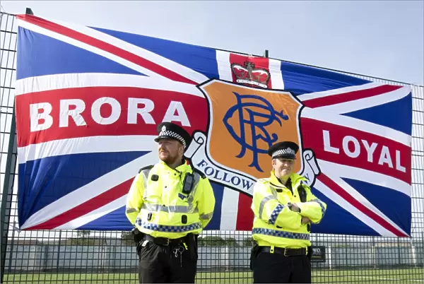 Police Protect Brora Rangers Flag During Pre-Season Clash: Rangers Win 2-0
