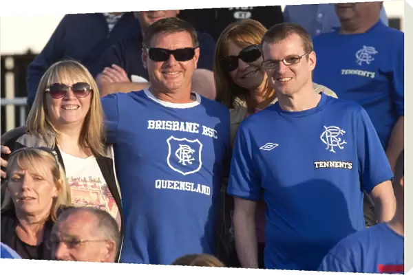 Rangers Fans Bask in Sunshine: Celebrating a 1-0 Victory at Elgin City