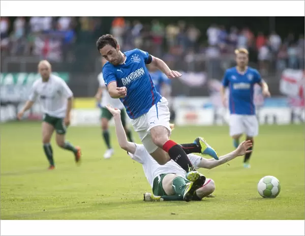 Rangers Take Early Lead: Lee Wallace Faces Tackle in Pre-Season Clash with FC Gutersloh 2000 (0-1)