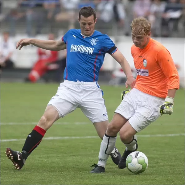 Rangers Jon Daly Attempts Bold Ball Theft from FC Gutersloh Goalkeeper in Pre-Season Clash (1-0)