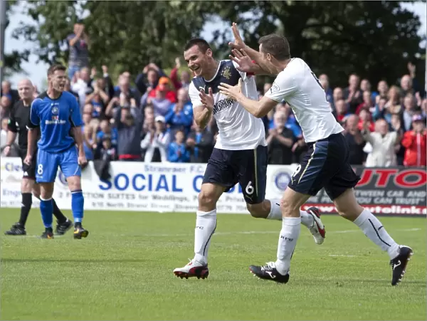 Rangers McCulloch and Daly: Celebrating a 3-0 Victory Over Stranraer in Scottish League One