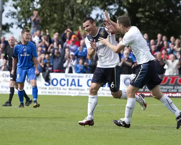 Rangers McCulloch and Daly: Celebrating a 3-0 Victory Over Stranraer in Scottish League One