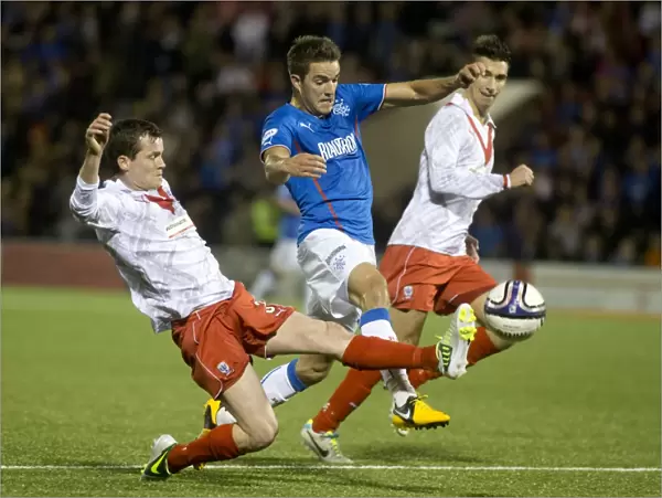 Rangers Dominance: Andy Little vs Paddy Boyle Clash in Rangers 6-0 Scottish League One Victory over Airdrieonians