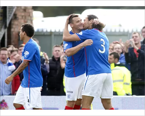 Rangers Mohsni and McCulloch: A Celebratory Moment after Scoring against Ayr United (2-0)