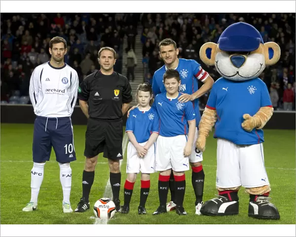Rangers Football Club: Celebrating Promotion and Scottish Cup Triumph with Captain Lee McCulloch and Mascots at Ibrox Stadium (2003)