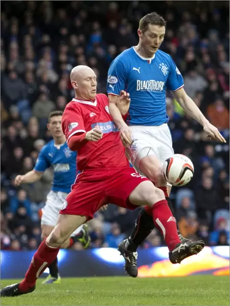Intense Rivalry: Jon Daly vs Gerry McLauchlan - The Battle for the Ball at Ibrox Stadium (Scottish Cup, 2003)