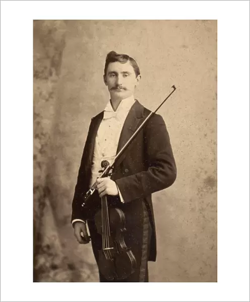 VIOLINIST, c1900. Charles d Almaine (1871-1943), noted solo violinist