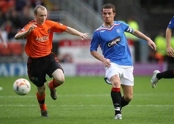 Barry Ferguson vs Willo Flood: A Rivalry Ignites in the Intense Dundee United vs Rangers Clydesdale Bank Premier League Match (2-1 in favor of Rangers)