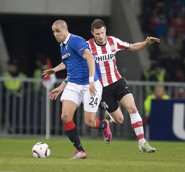 Bougherra vs Pieters: A Battle at Philips Stadion - Rangers vs PSV Eindhoven, UEFA Europa League Round of 16 First Leg (0-0)