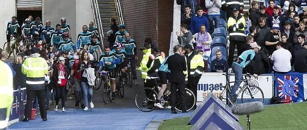 Charity Cyclists In Action Amidst the Ladbrokes Championship Match at Ibrox Stadium