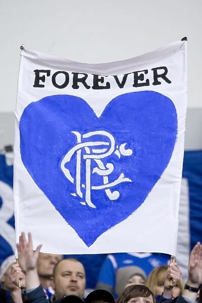Disappointed Rangers Fans Rally with We'll Be Back Banner Amidst 0-1 Defeat at Ibrox Stadium