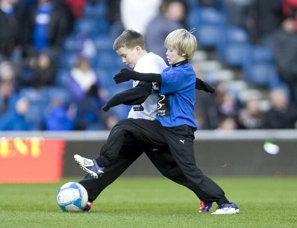 Half Time at Ibrox: Rangers Football Club vs Kilmarnock - Soccer Schools in Action Amidst a 1-0 Deficit