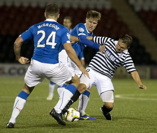 Intense Clash: Marius Zaliukas vs Ross McPherson - Rangers Holds Off Queens Park in Scottish League Cup