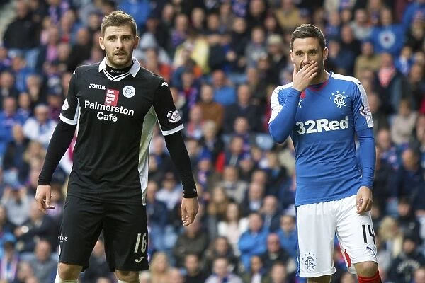 Intense Moment: A Heart-to-Heart Between Kyle Hutton and Nicky Clark at Ibrox Stadium during Rangers vs Queen of the South