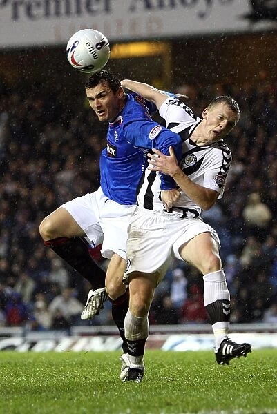 Intense Rivalry: Rangers vs St Mirren - A Battle for the Ball Results in a 4-0 Ibrox Victory